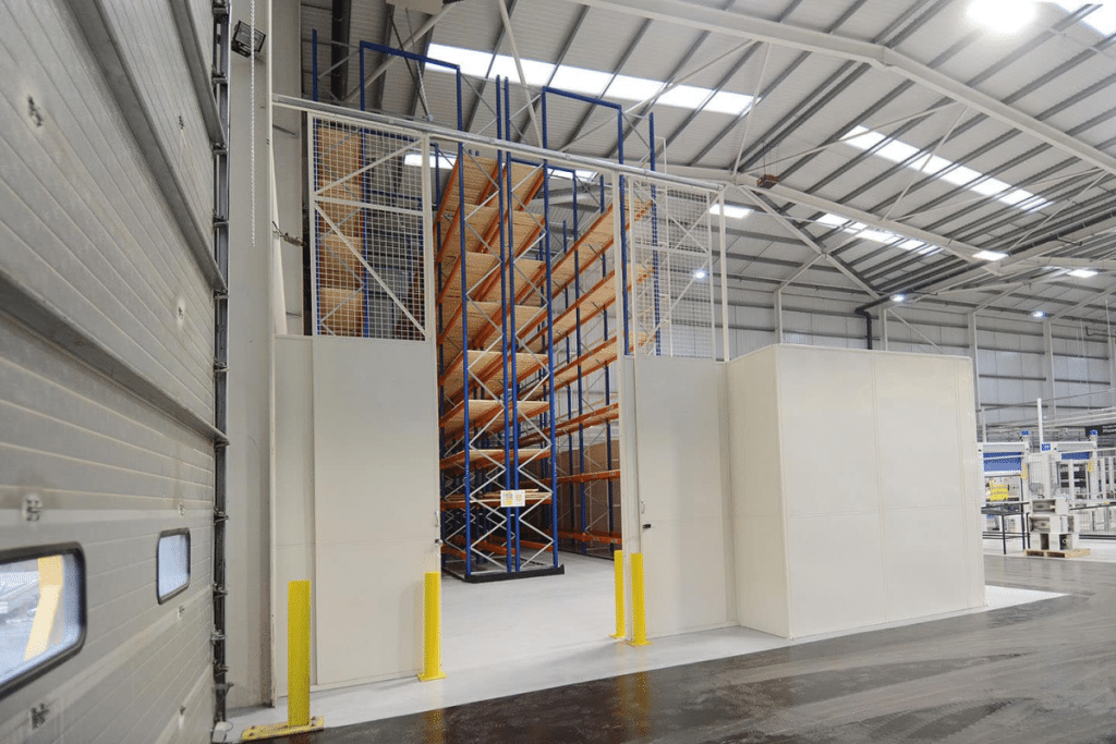 warehouse-dividing-walls-partitions Industrial partitioning wall systems installed in a warehouse by Teepee Materials Handling